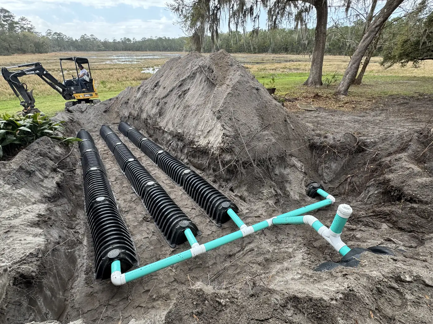 New drain field chambers and distribution header with the LCI excavator behind